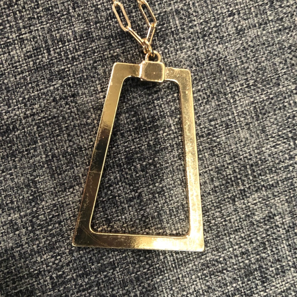 Long gold necklace with rectangular shaped pendent